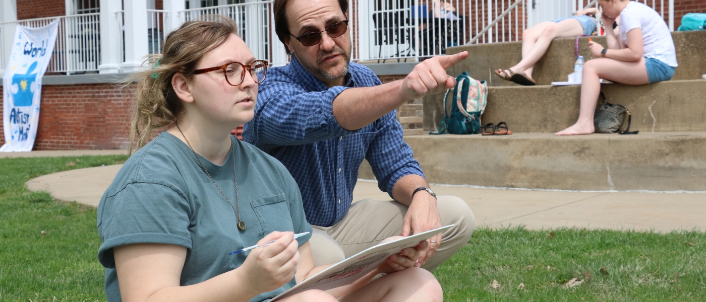 professor instructing female student