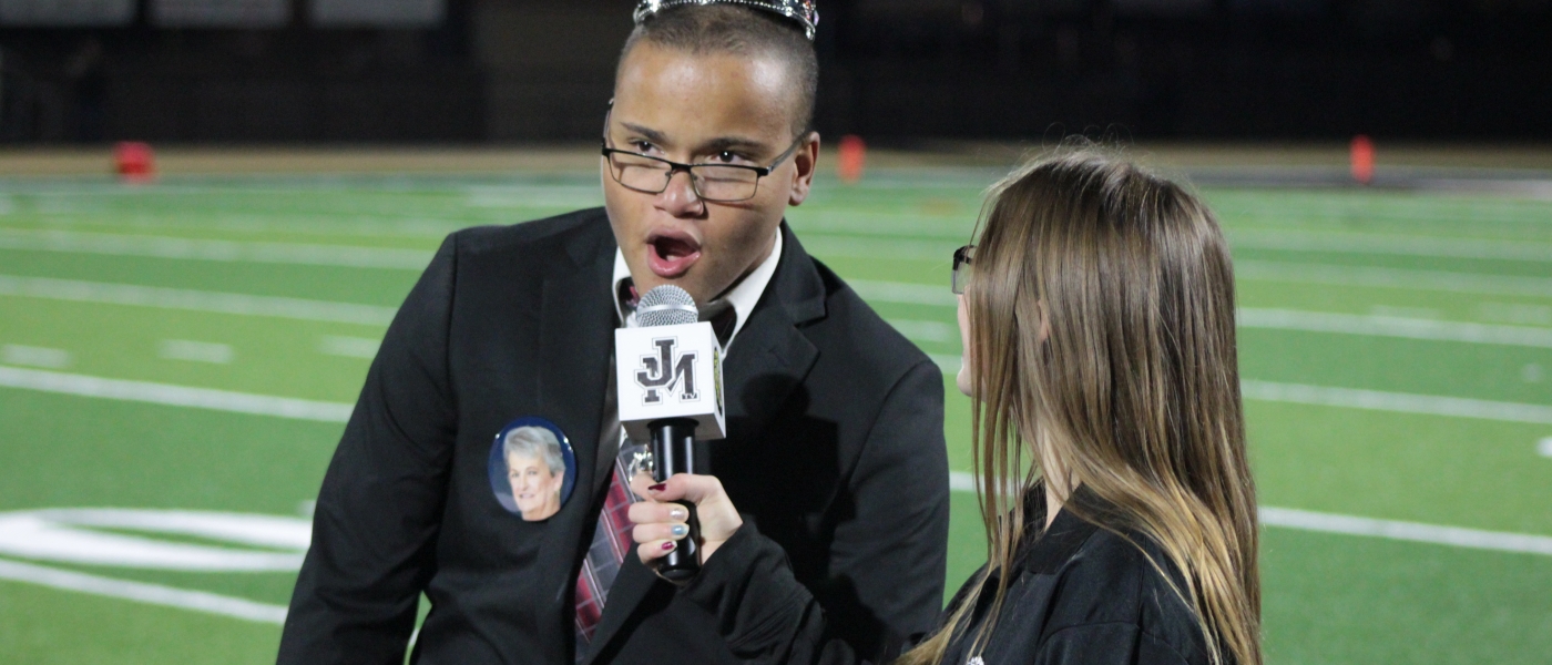 STUDENT INTERVIEWING HOMECOMING KING