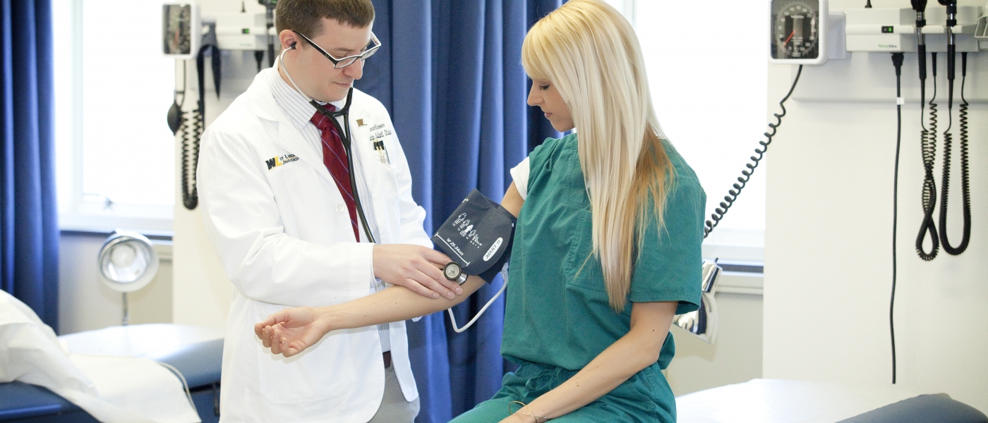 student taking blood pressure