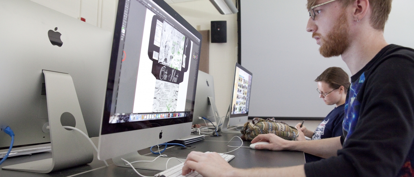 art students working on a computer